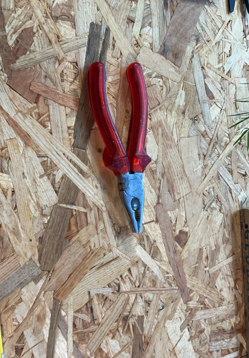 Combination pliers with red handles